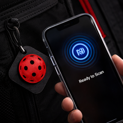 Red pickleball design with a black strap held next to a smartphone displaying a 'Ready to Scan' message.