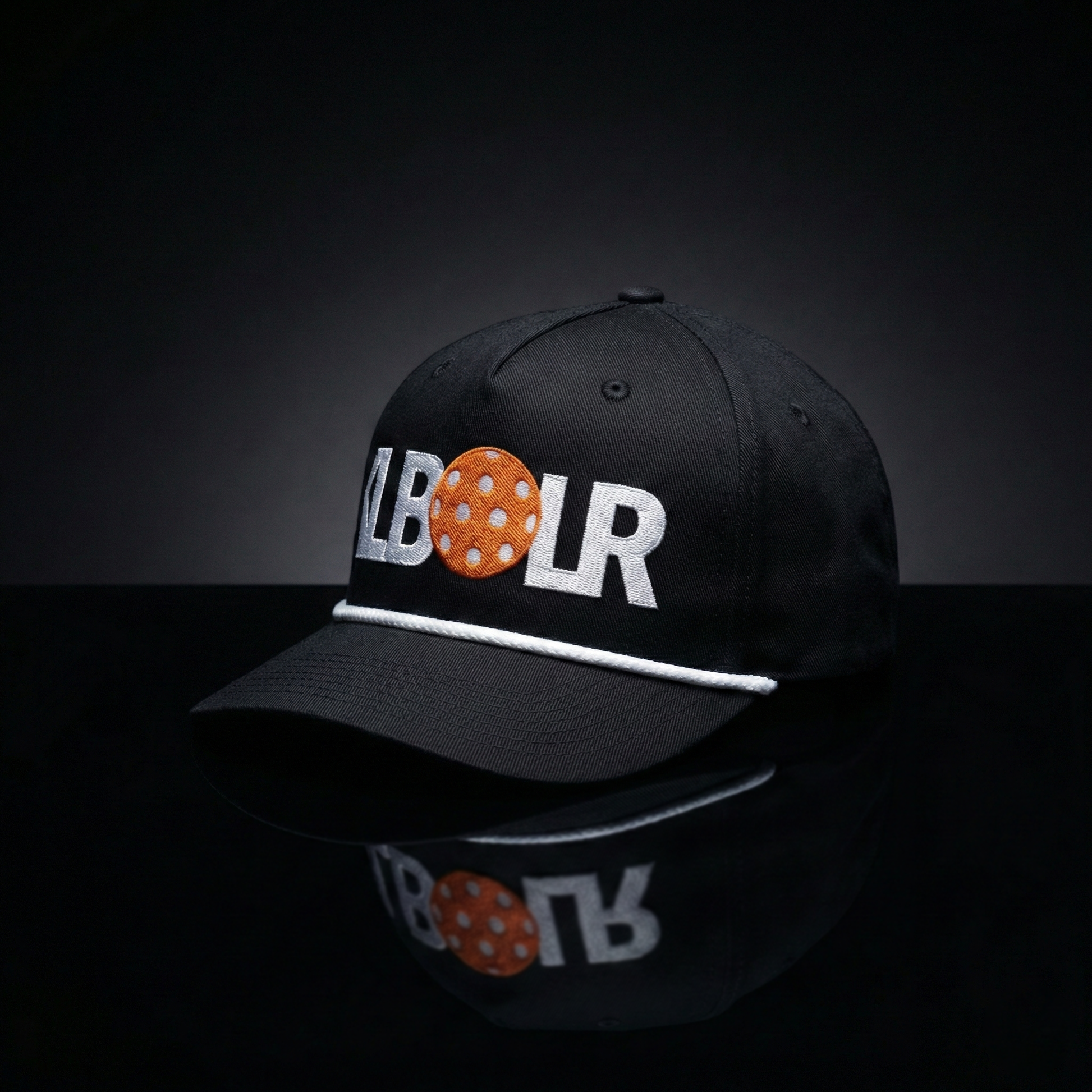 Black cap with 'LBOR' logo on a reflective black surface
