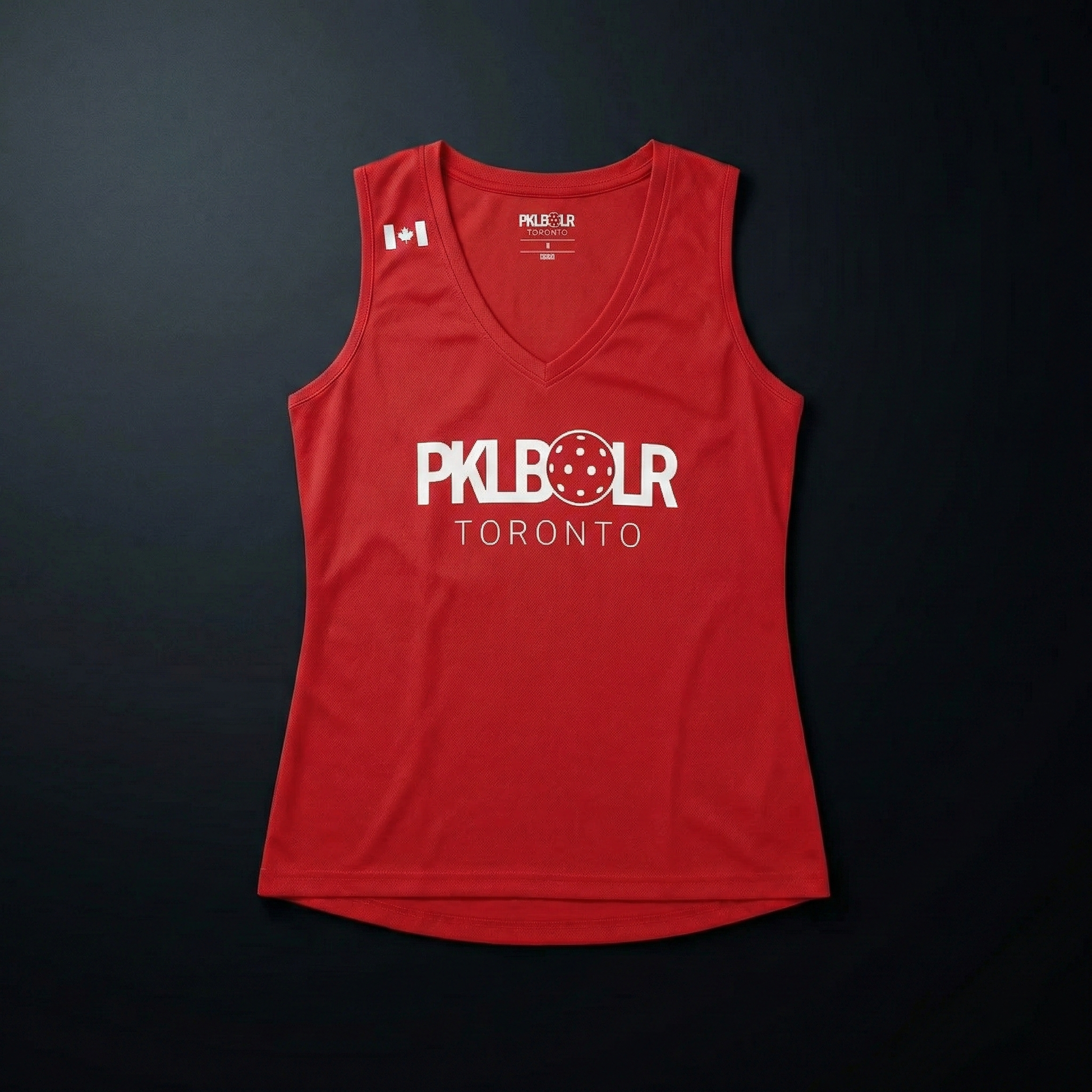 Red sleeveless shirt with 'PKL BOLR Toronto' text on a black background