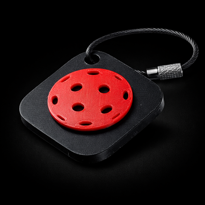 Black square NFC keychain with a pickleball design.
