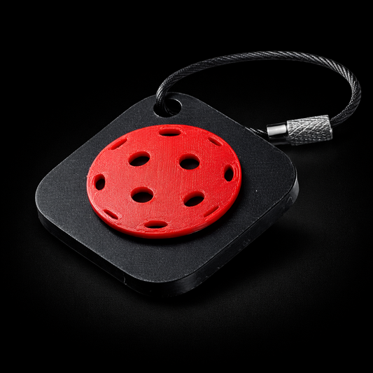 Black square NFC keychain with a pickleball design.